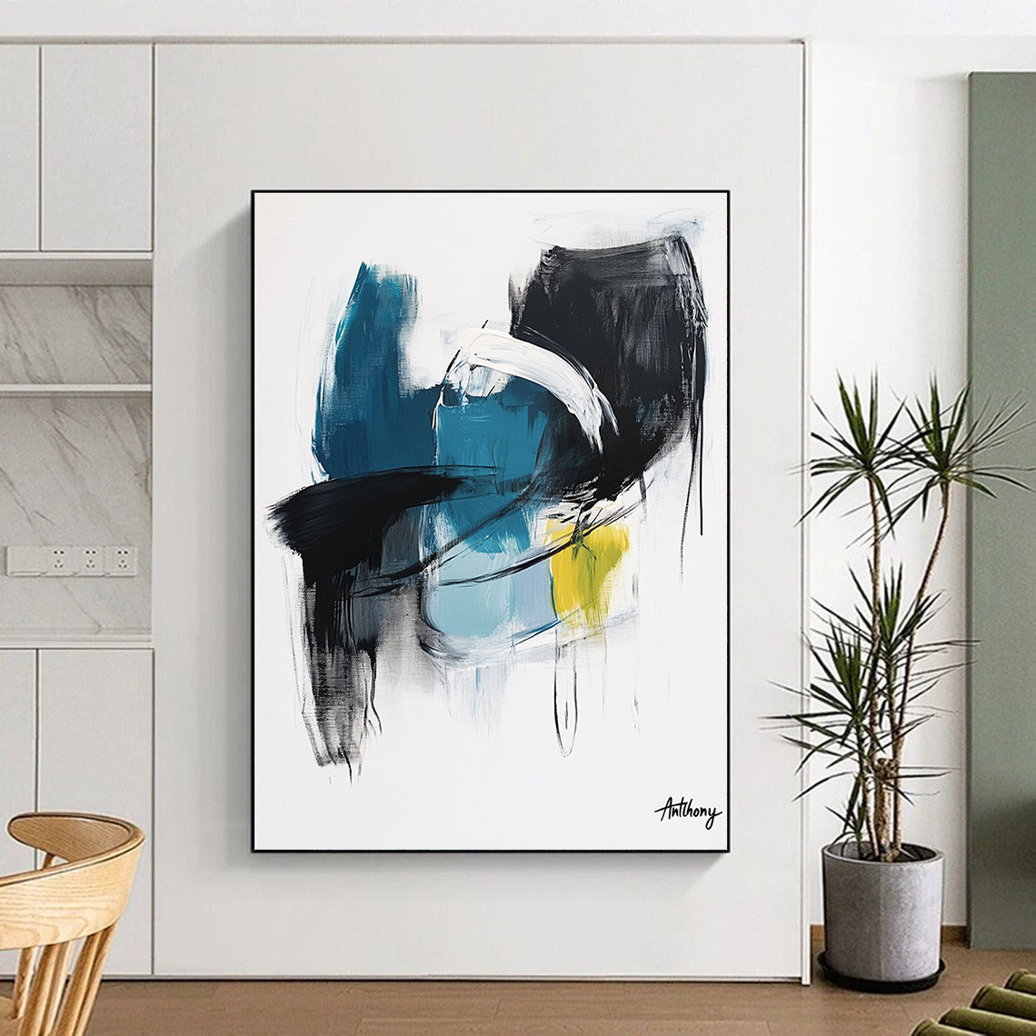 Large abstract painting in blue black and white tones with yellow accent by Anthony evoking calmness and serenity through soft brush strokes and thick lines.STSC1068