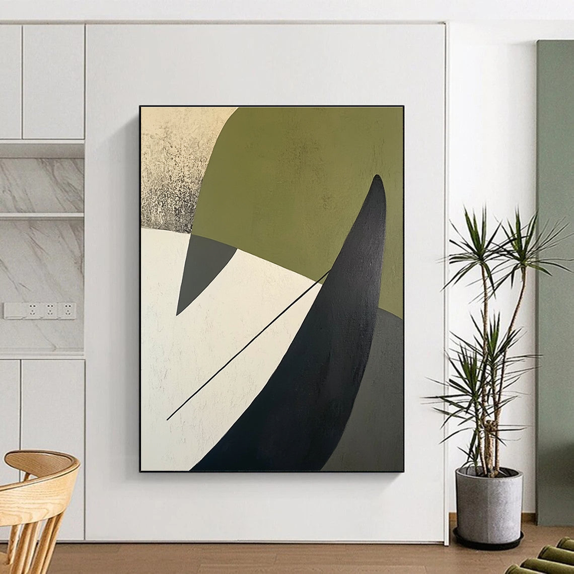 A large abstract painting featuring green white and black shapes on a beige background with a dark gray arrow-like line on the left side.STSC684