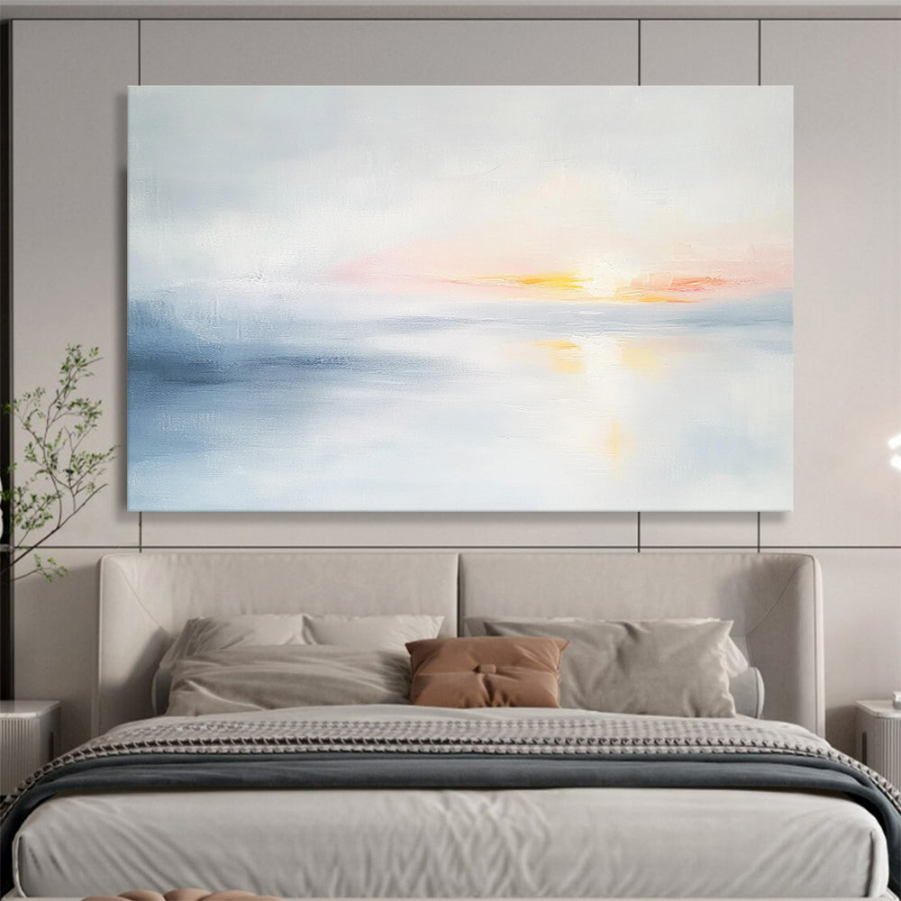 Large abstract painting featuring soft light sky blue and gray tones depicting a serene sunset over calm water on a white background.SC082