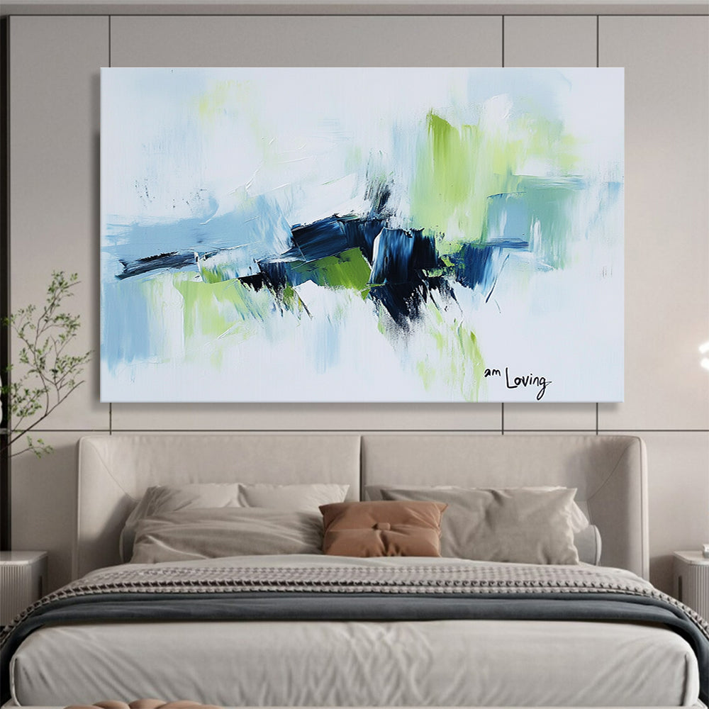 Abstract painting with a white background highlighted by light blue and green accents features expressive brush strokes and the words am loving.SC214