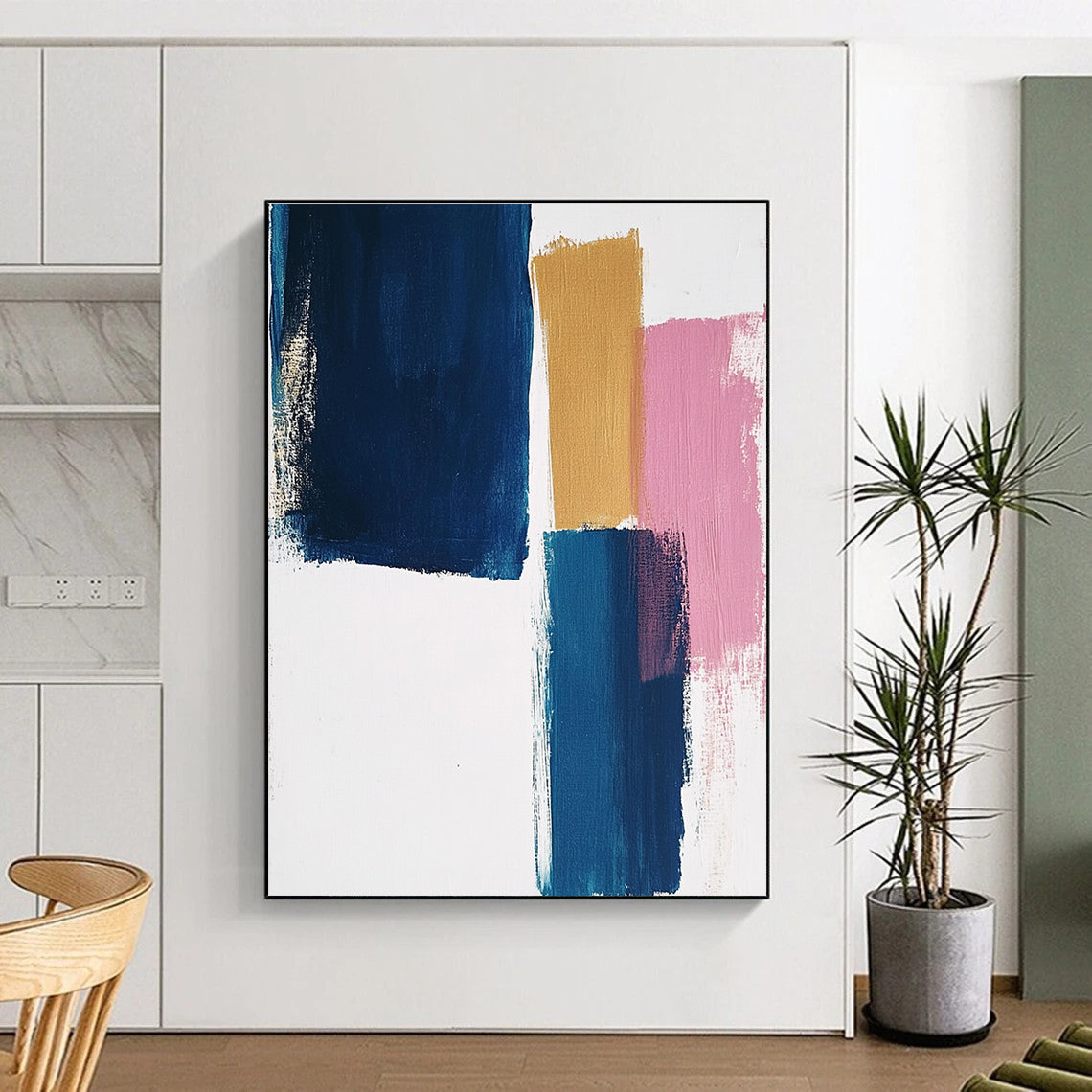 Large abstract painting featuring thick brush strokes on a white background with blocks of blue mustard and pastel pink colors.STSC1343