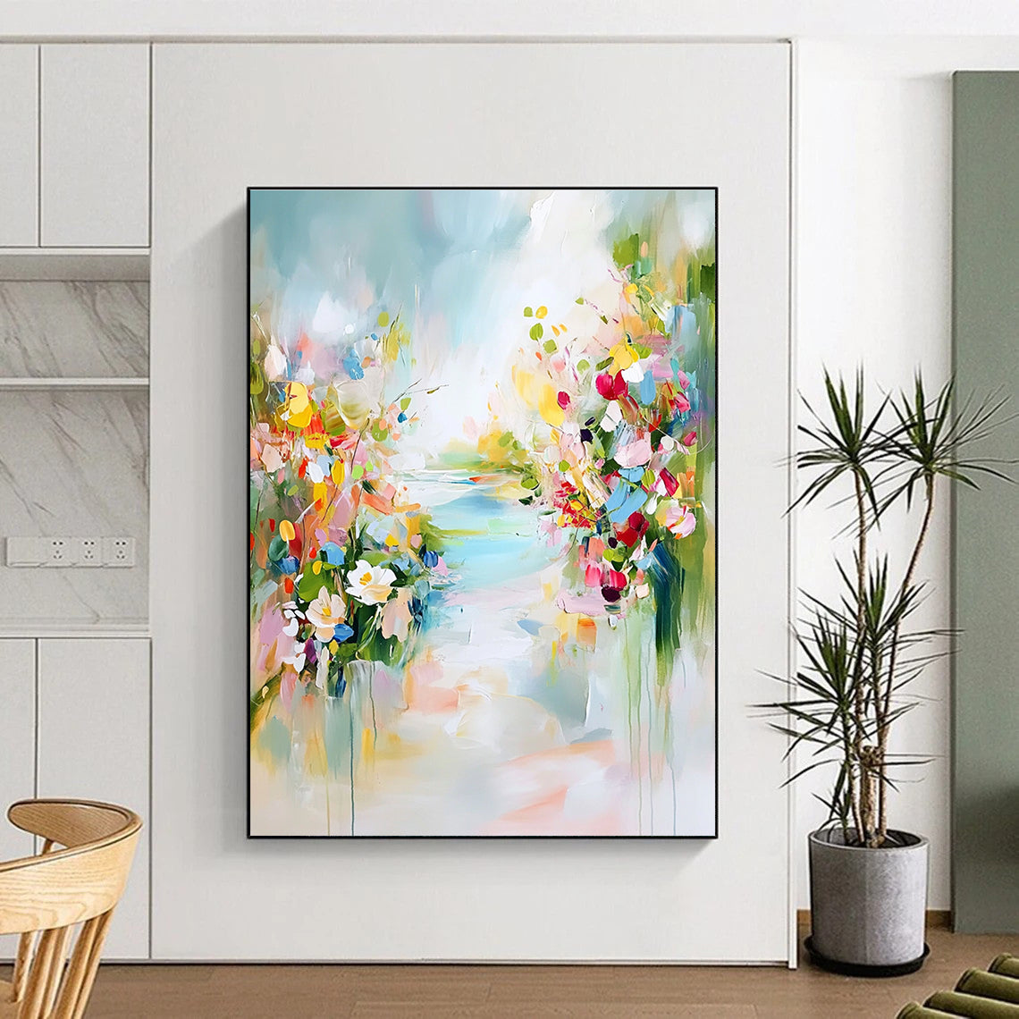 A large abstract painting depicting a tranquil spring landscape with colorful flowers soft skies and hints of blue water.STSC891