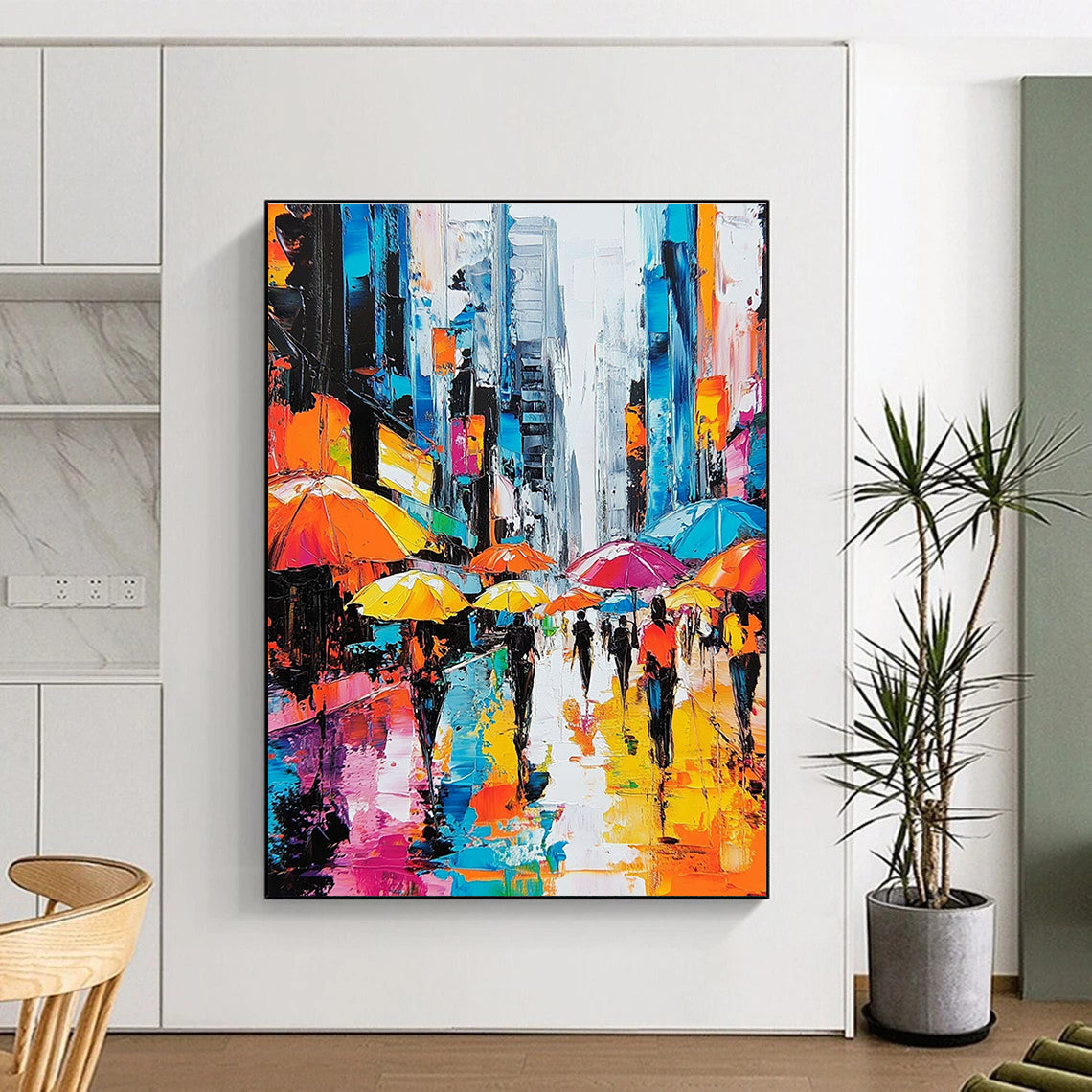 A large abstract painting depicting vibrant city streets with people under colorful umbrellas and towering skyscrapers highlighting urban energy and movement.STSC872