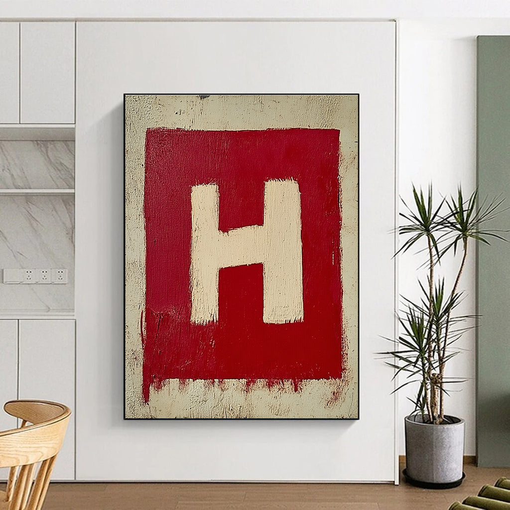A large abstract painting featuring a minimalistic red and white letter H on textured canvas, showcasing simple brush strokes in oil paint.STSC1163
