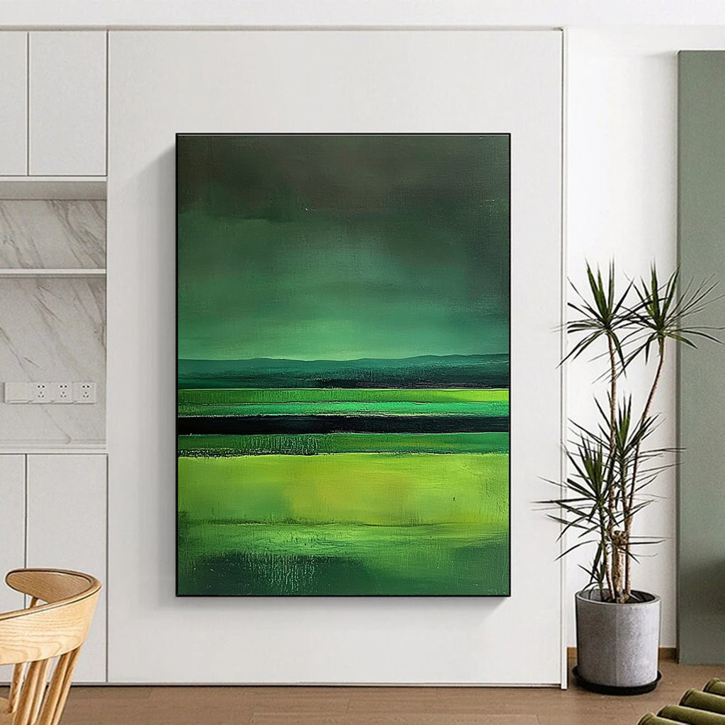 Large abstract painting featuring green fields dark sky and lake in a minimalist style with fluid lines inspired by Mark Rothko.STSC309