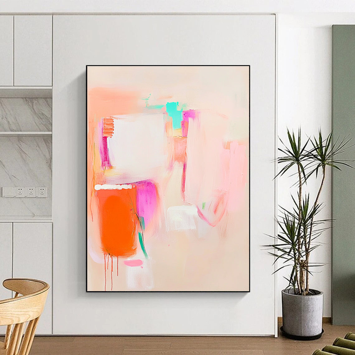 Large abstract painting in soft pink orange and white featuring everyday objects for a calming and dreamy effect on a light beige background.STSC623