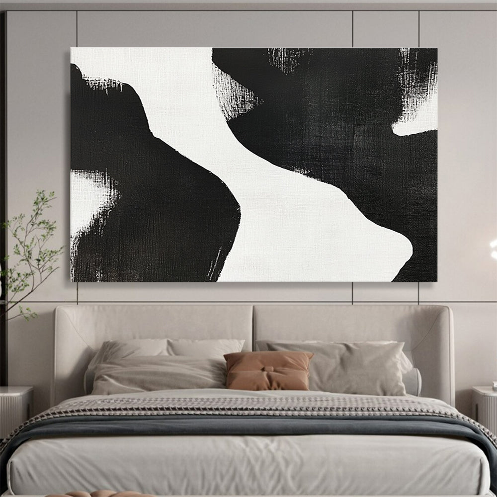 Large abstract painting featuring black and white brush strokes depicting two women’s bodies against a plain white background, showcasing minimalist artistry and tranquil form.SC439