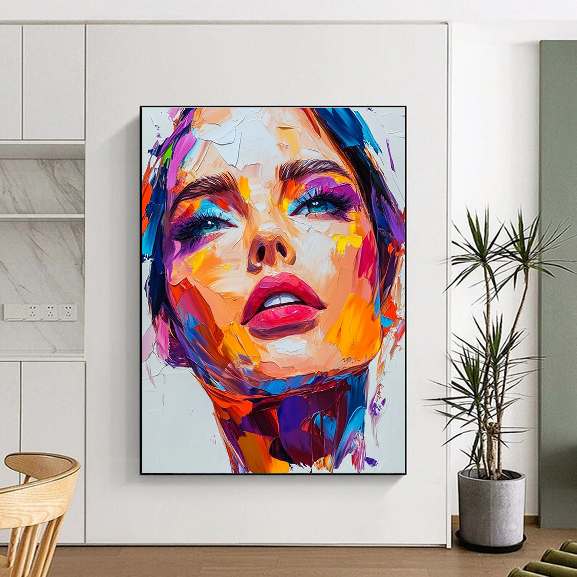 An abstract painting featuring a close-up portrait of an attractive woman with vibrant colors and thick brush strokes on a white background.STSC1162