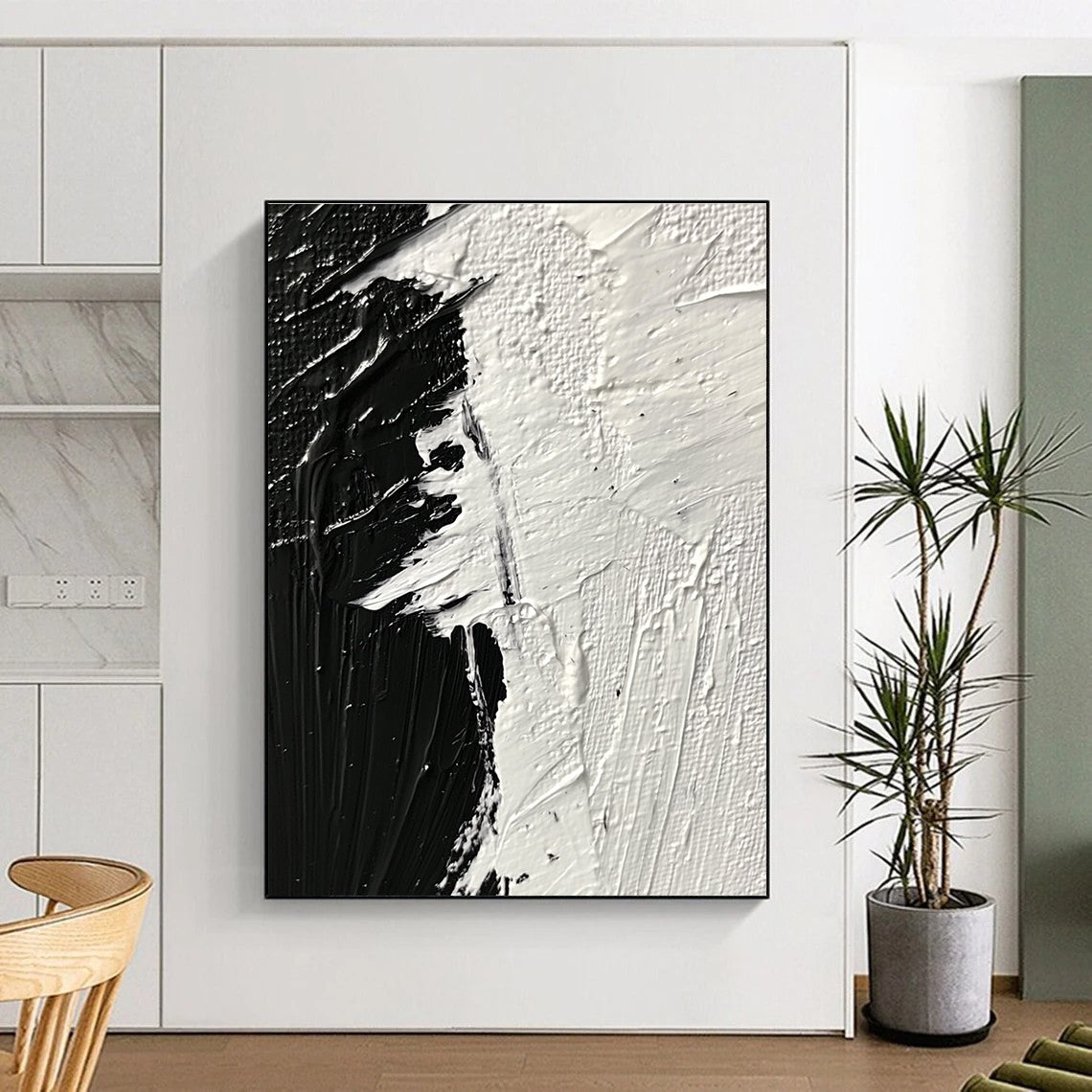 Large abstract painting featuring thick textured brushstrokes in striking black and white tones that evoke profound emotion and creativity.STSC1282