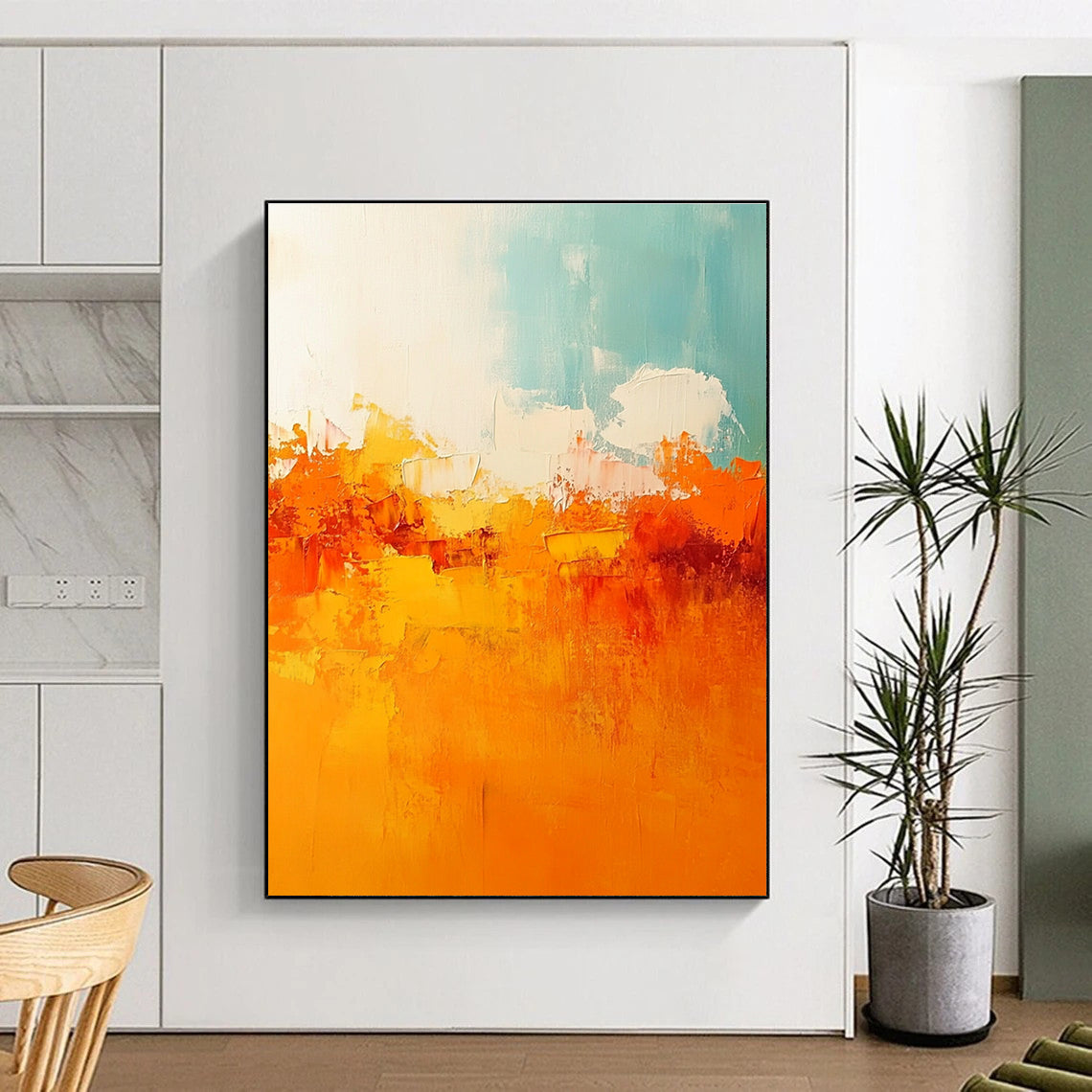 Large abstract painting featuring warm tones of orange and yellow with soft edges and brushstrokes depicting a serene sunset sky.STSC119