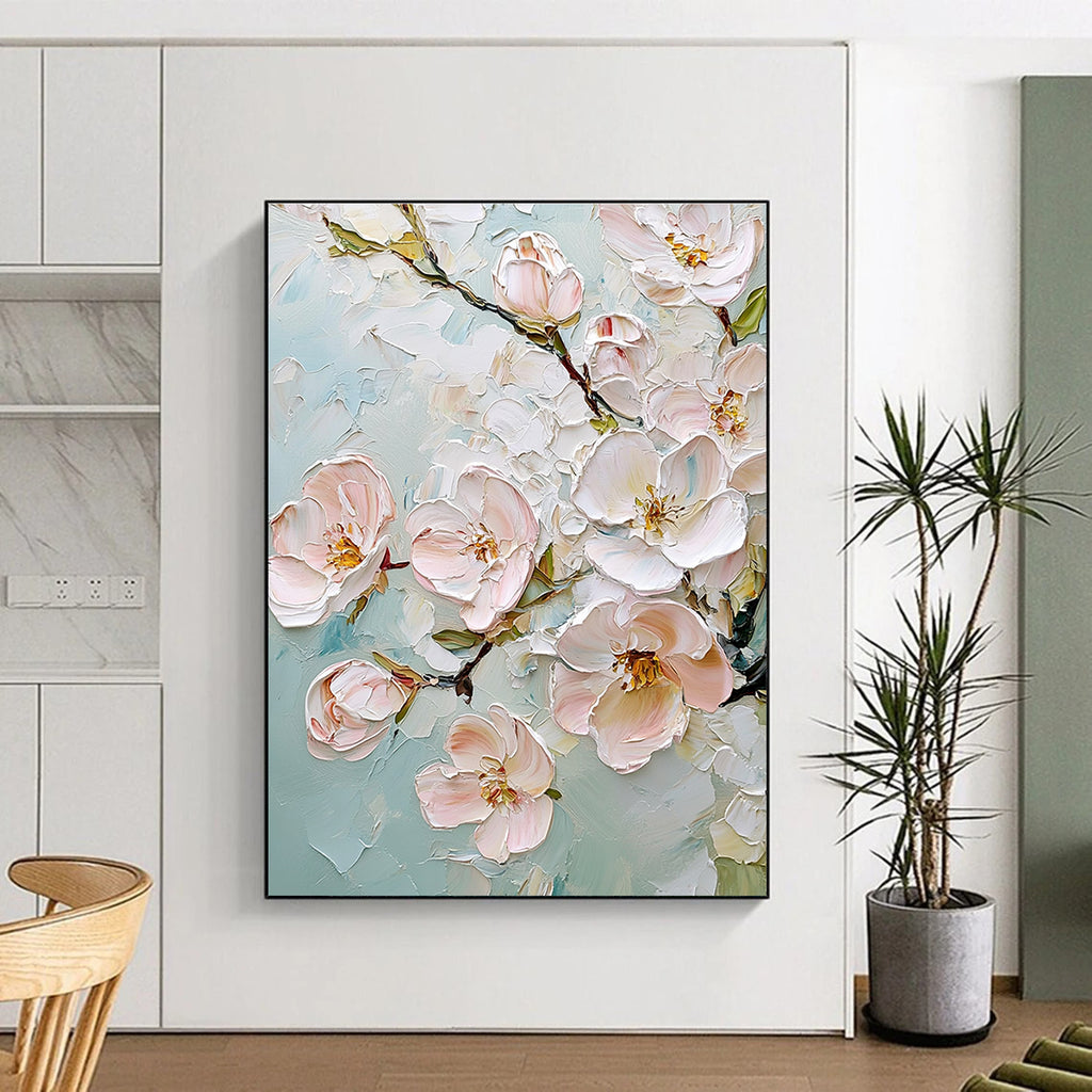 Large abstract painting featuring delicate cherry blossoms in soft pink and white against a light blue background with rich impasto texture.STSC875