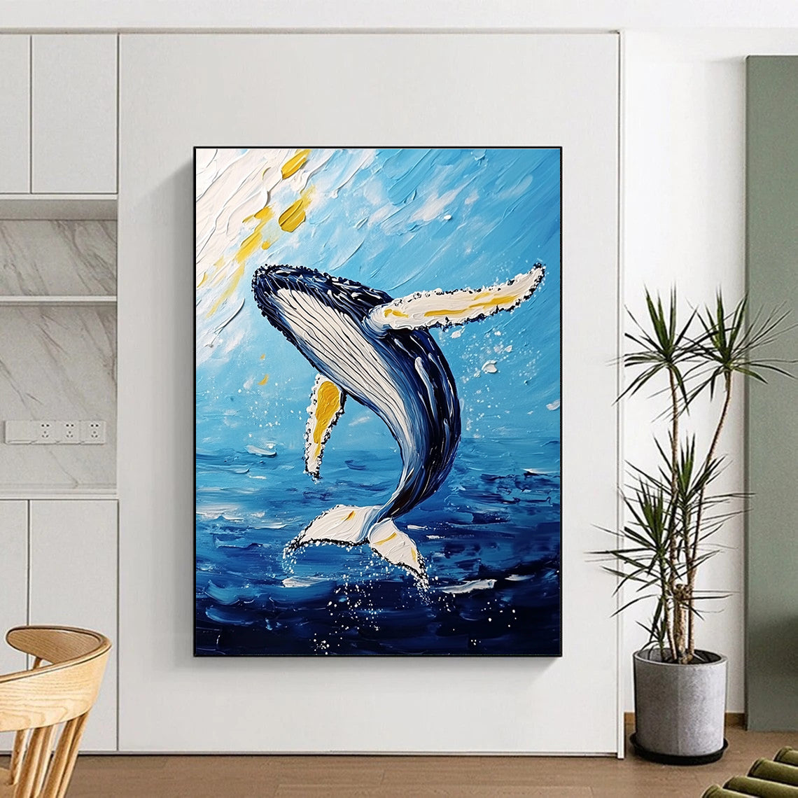 Large abstract painting featuring a majestic humpback whale mid-air with vibrant white and yellow brushstrokes against a light sky-blue and dark gold background.STSC1231