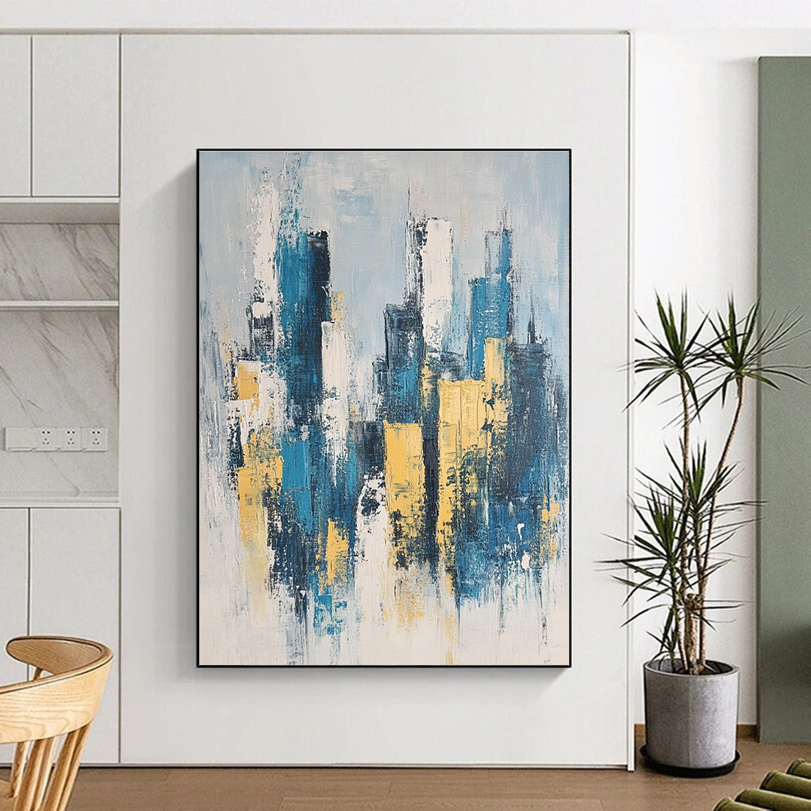 Large abstract painting featuring a modern cityscape in neutral blue and gray tones with yellow accents inspired by impressionist style.STSC1358