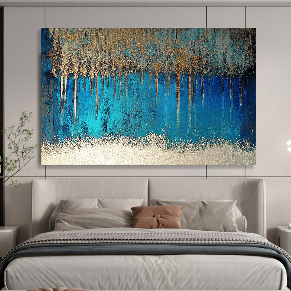 A large abstract painting featuring blue and silver patterns with glittering white sand and a rich brown liquid, accented by a thin silver line.SC346