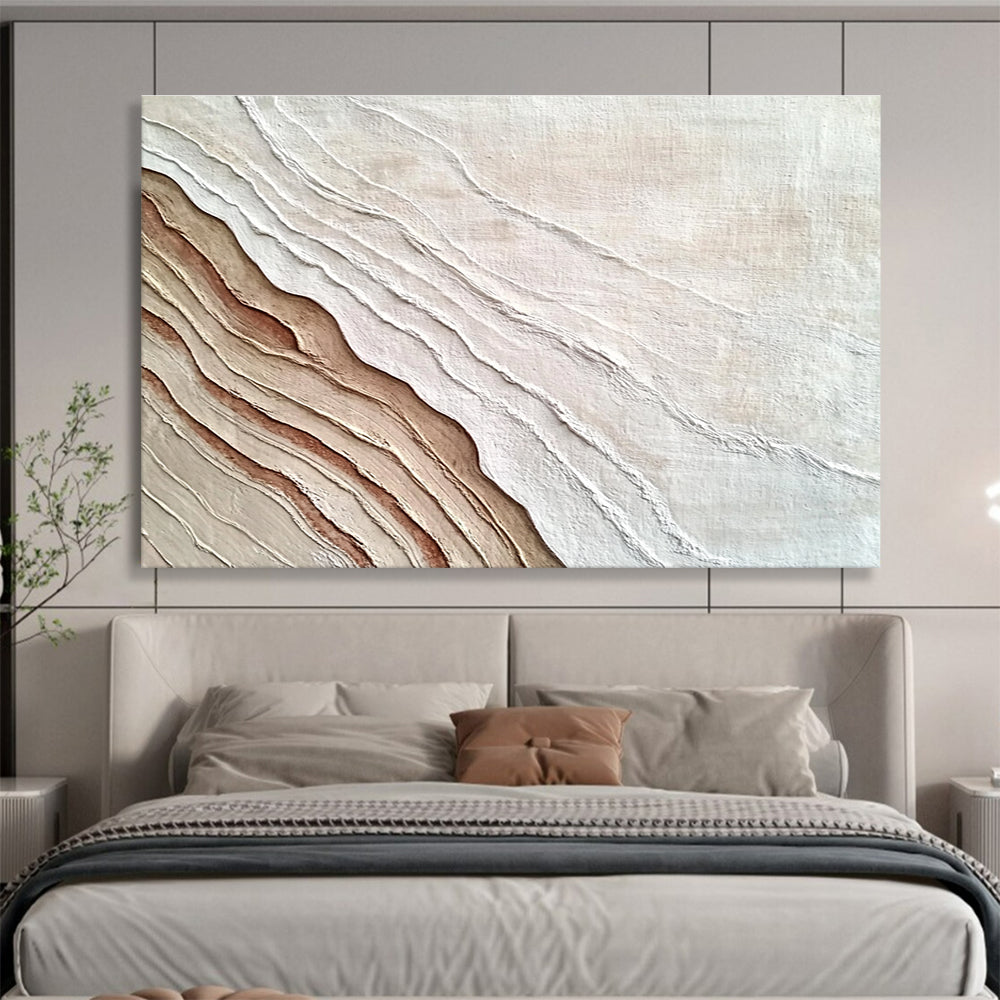An abstract painting featuring the interplay of sand and water in white and brown hues, symbolizing growth and change through rich textures.SC448