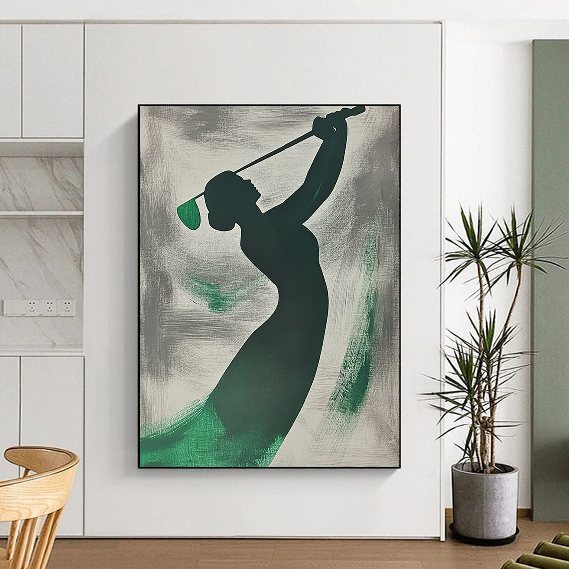 A large abstract painting featuring a silhouette of a woman playing golf with emerald green brushstrokes on a grey background.STSC1065