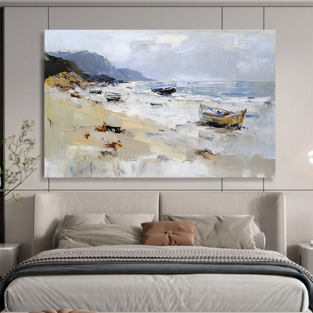 Large abstract oil painting of a beach with loose brush strokes featuring white gray and brown colors and visible sea spray and mountains in the background.SC605