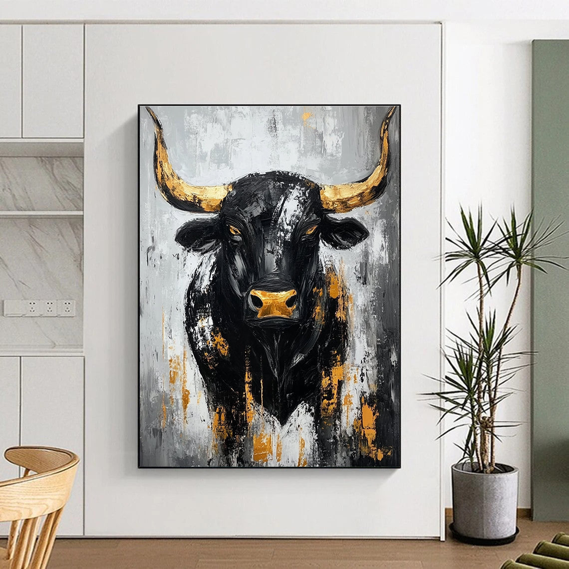 Large abstract painting of a black bull with gold accents against a gray background featuring bold brush strokes and textured impasto technique.STSC027