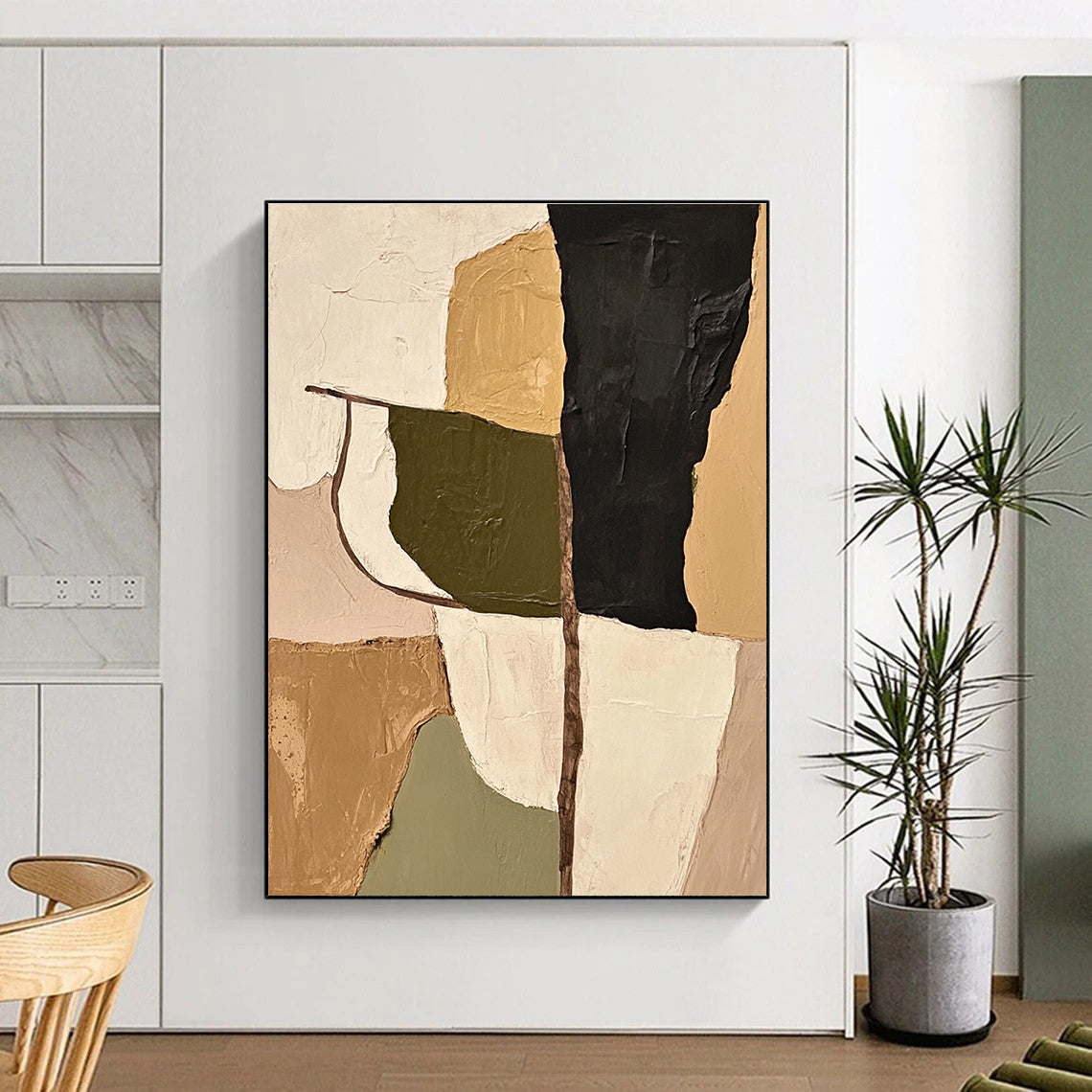 Large abstract painting featuring olive green beige and black shapes with thick impasto strokes that adds depth and texture to any space.STSC696