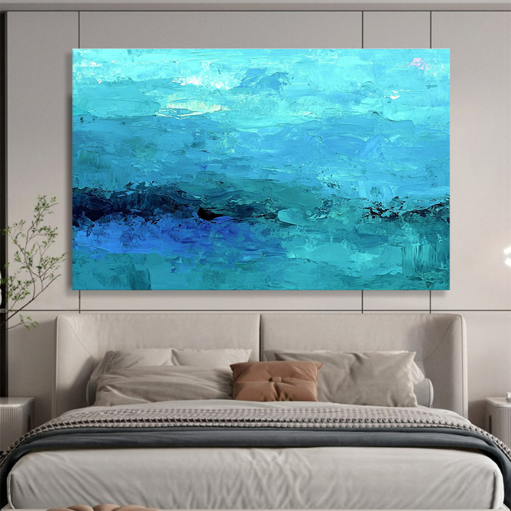 Large abstract painting of the ocean in soft blues and teals showcasing impressionistic waves and a mysterious silhouette beneath gentle mist.SC201