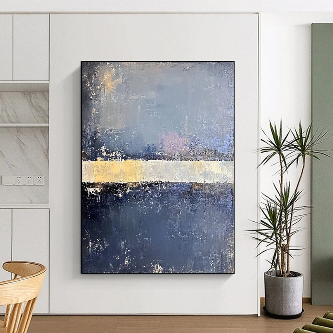 Large abstract painting in faded hues of blue gray and pale yellow with soft edges on a dark gray background featuring a white bar.STSC218