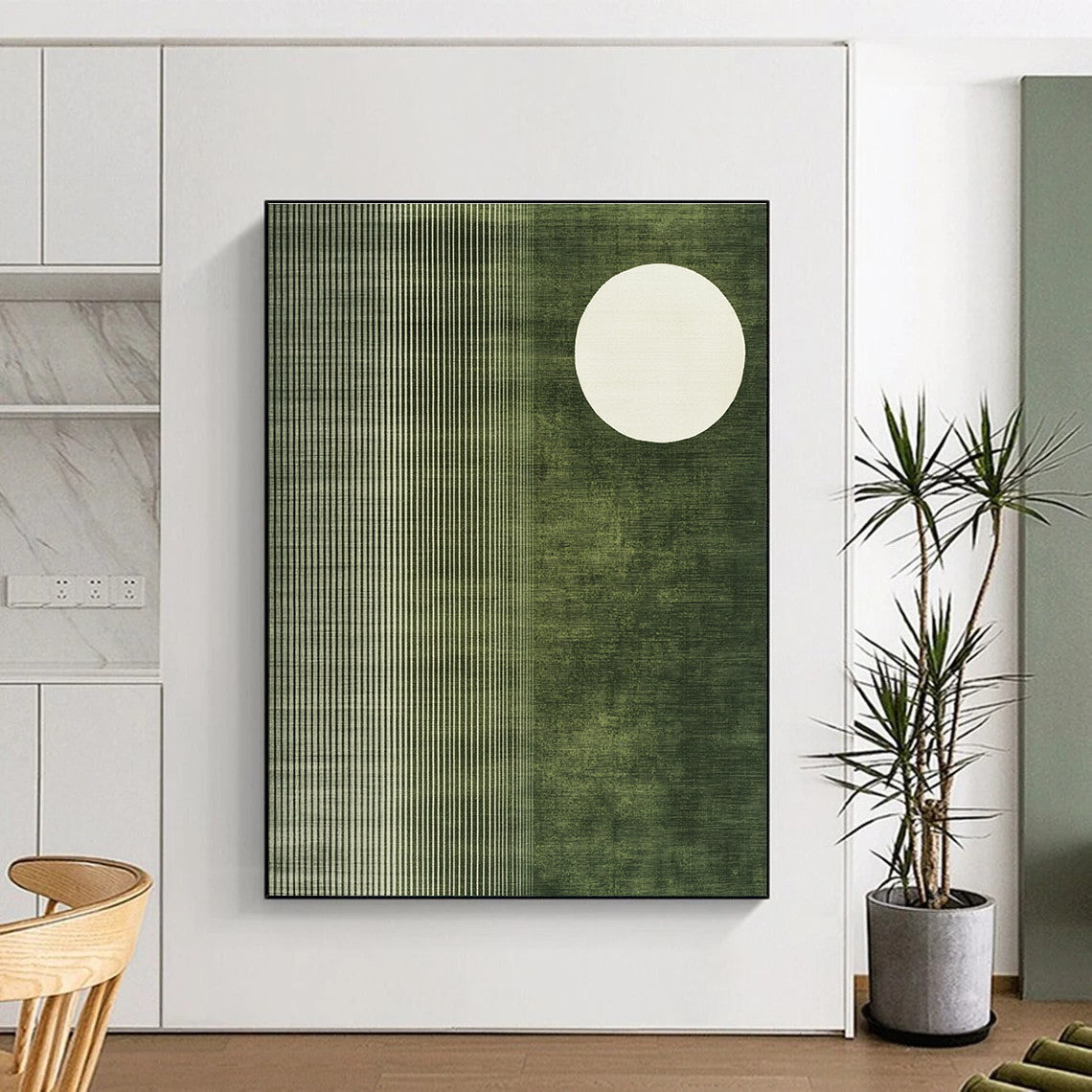 Abstract painting featuring a white circle on olive green fabric-like background with organic patterns and a white half-moon in the corner.STSC1251