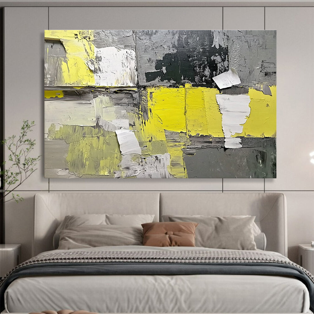 Large abstract painting featuring gray and yellow hues with textured paper elements extending from the wall for added dimension.SC240