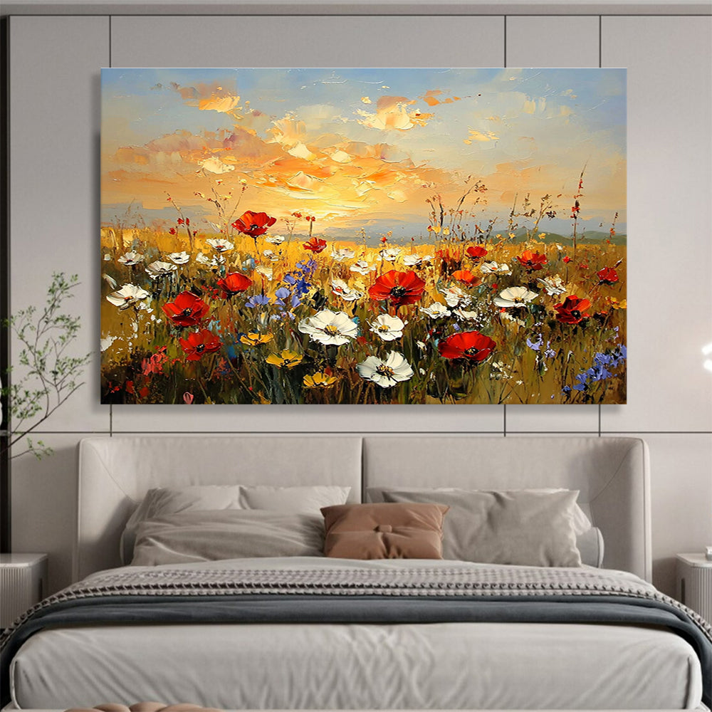 Large abstract painting of a wildflower field at sunset featuring red poppies white daisies and yellow sunflowers in vibrant hues of orange and blue.SC464