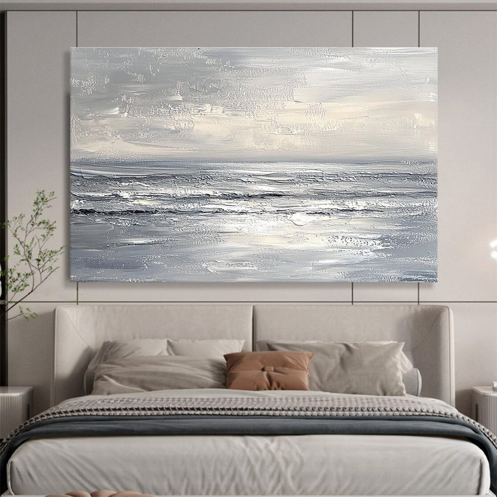Abstract seascape in impasto oil, featuring textured strokes in muted whites and greys, capturing a minimalist beach with soft waves and sky.SC276