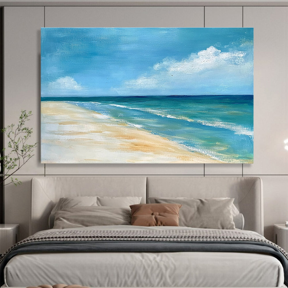 A large abstract painting of the ocean sky and sandy beach in muted blue tones with green accents and soft clouds for a serene ambiance.SC362