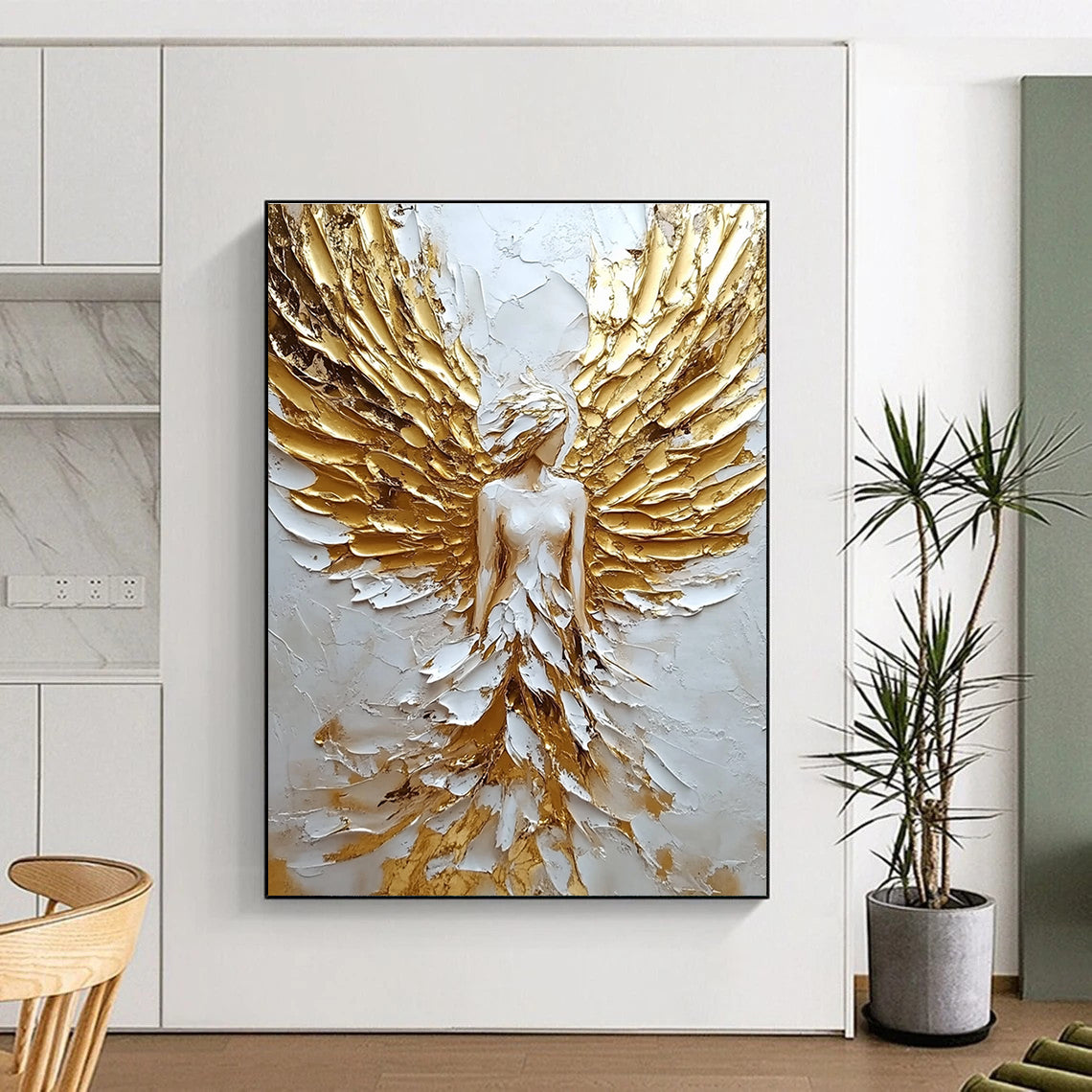Large abstract painting of an angel with golden wings on textured canvas showcasing a white and gold color palette.STSC142