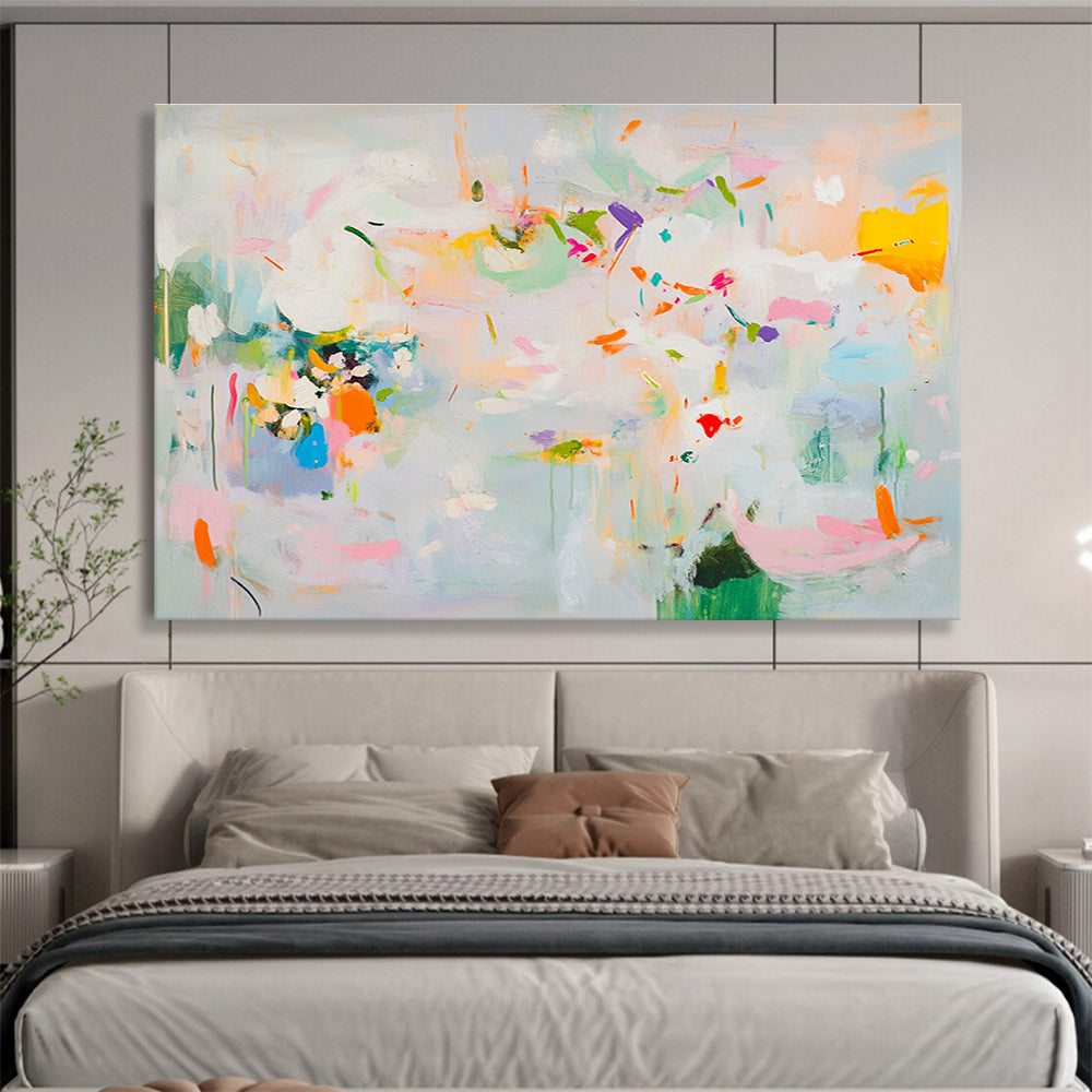 Large abstract painting in soft pastels featuring spring themes with flowers leaves trees and vibrant splashes of color creating a lively atmosphere.SC384