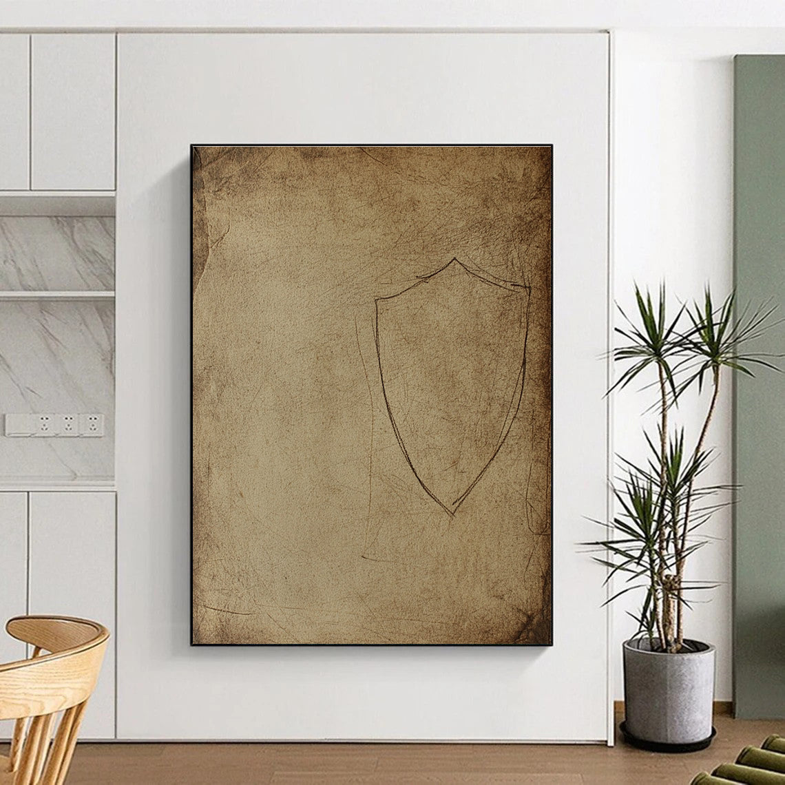 Large abstract drawing of an ancient shield silhouette on aged paper with rough edges and dusty marks resembling early human civilization cave art.STSC987