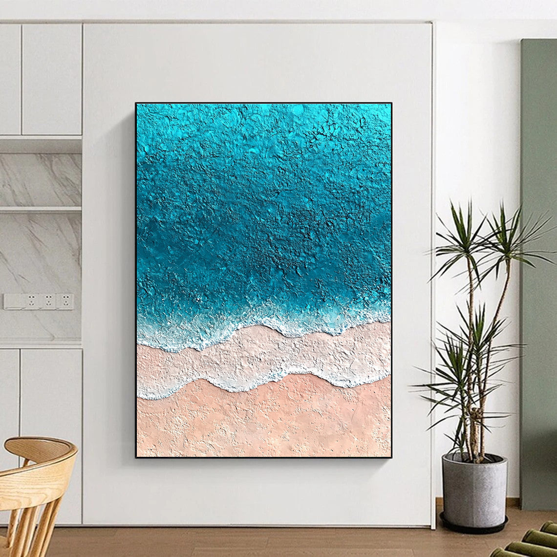 Large abstract painting featuring textured sand and vibrant blue sea with soft watercolor gradients creating an immersive oceanic experience.STSC1428