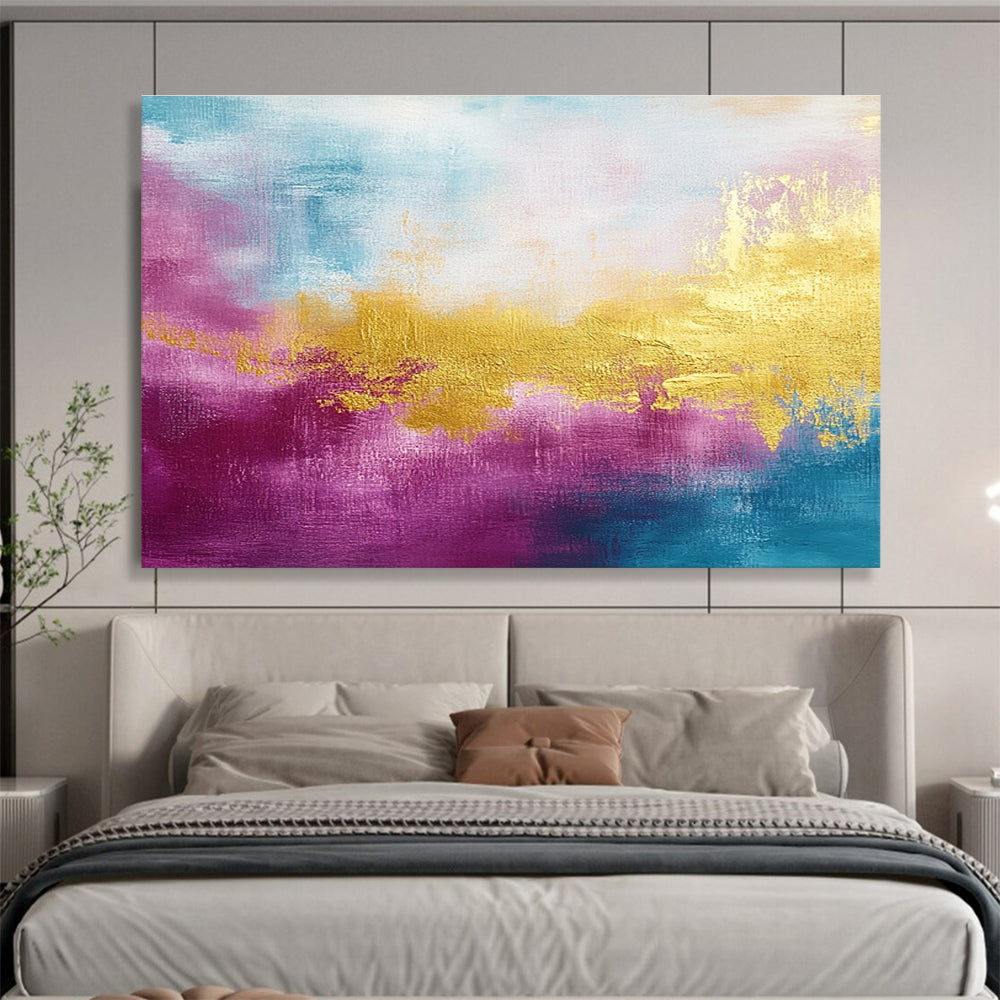 A large abstract painting features gold, magenta, and cyan hues with soft brush strokes and a tranquil water-inspired backdrop.SC322