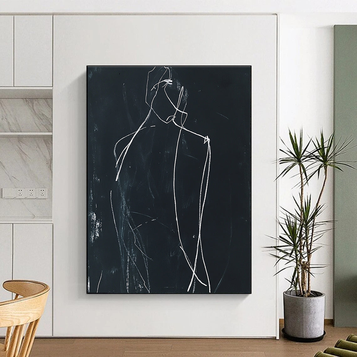 Large abstract drawing featuring a minimalist human figure in white chalk on black paper with soft lighting and shadows enhancing its form.STSC976