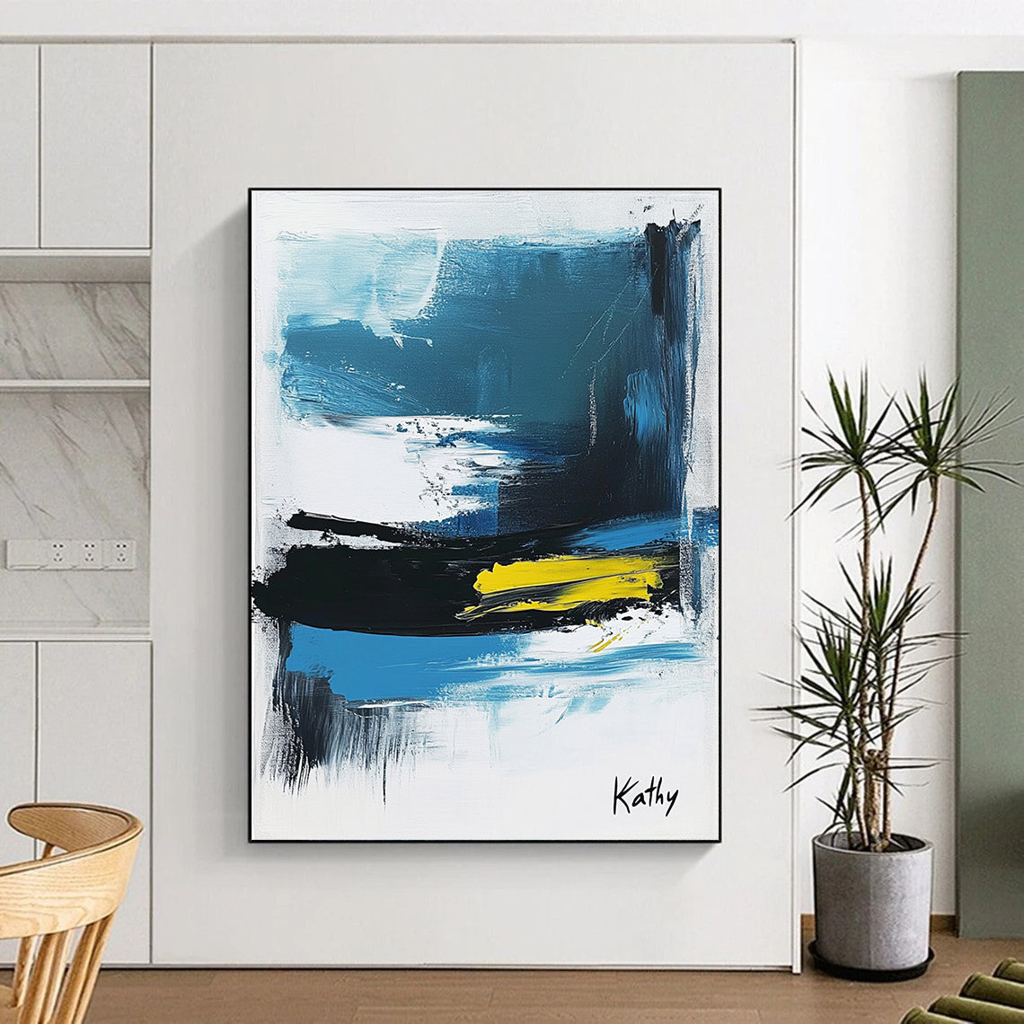 Large abstract painting of the sea featuring blue black and white brush strokes with yellow accents signed by Kathy.STSC1423