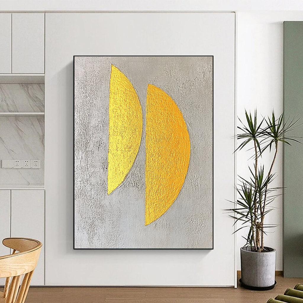 Large abstract painting featuring two yellow semicircles on a textured grey background with gold leaf highlights in a minimalist style.STSC356