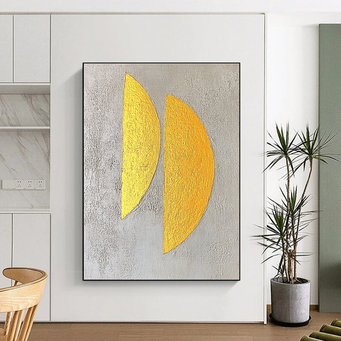 Large abstract painting featuring two yellow semicircles on a textured grey background with gold leaf highlights in a minimalist style.STSC356