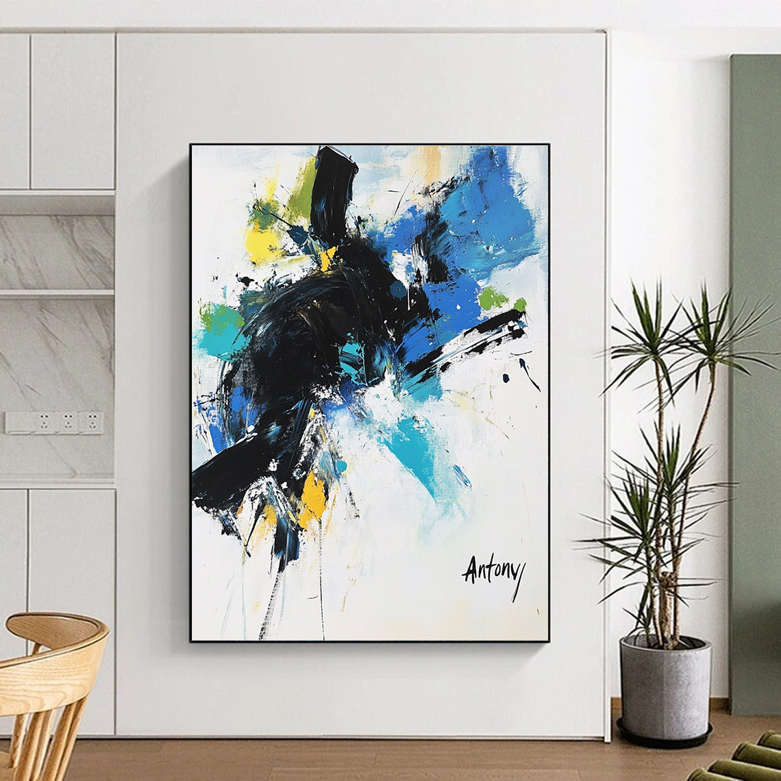 Abstract painting with black brush strokes and blue green yellow accents featuring the name Antony in large letters against a white background.STSC038