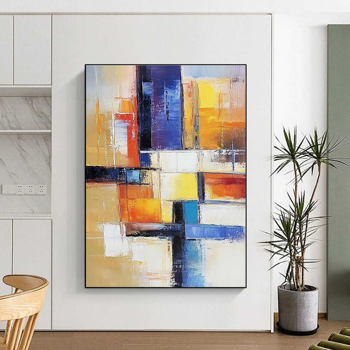Large abstract painting of an urban landscape in warm colors featuring geometric shapes and soft lines on canvas.STSC153