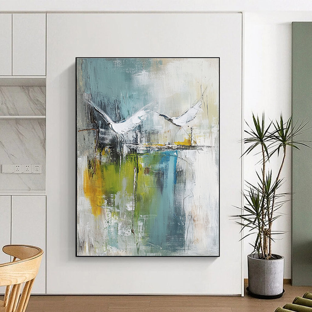Large abstract painting of birds soaring over water in pale green and white with hints of blue beige and gray in a mixed media style.STSC303