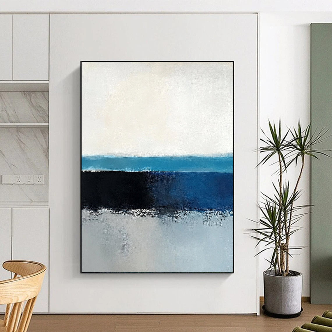 Large abstract painting of the ocean horizon featuring blue and gray tones in a minimalist style with neutral colors.STSC342