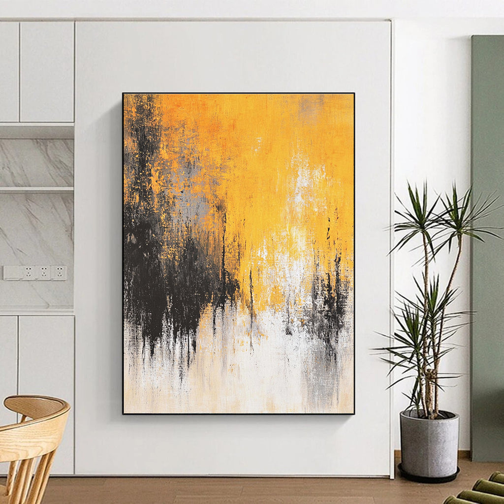 Large abstract painting featuring faded textures and dreamy shades of mustard yellow grey white and black depicting distant trees and a flowing river.STSC728