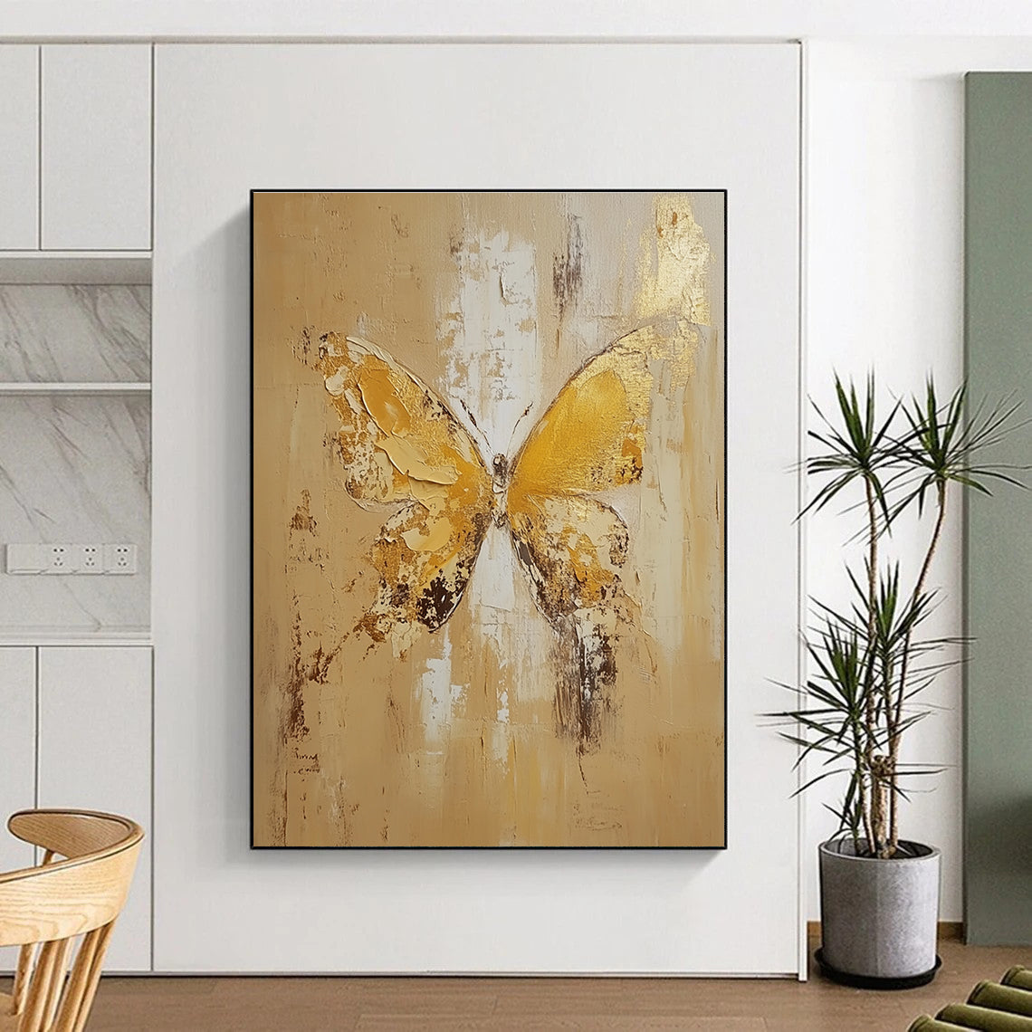 Large abstract painting of a butterfly in light yellow and beige tones with gold leaf and textured oil on canvas.STSC252