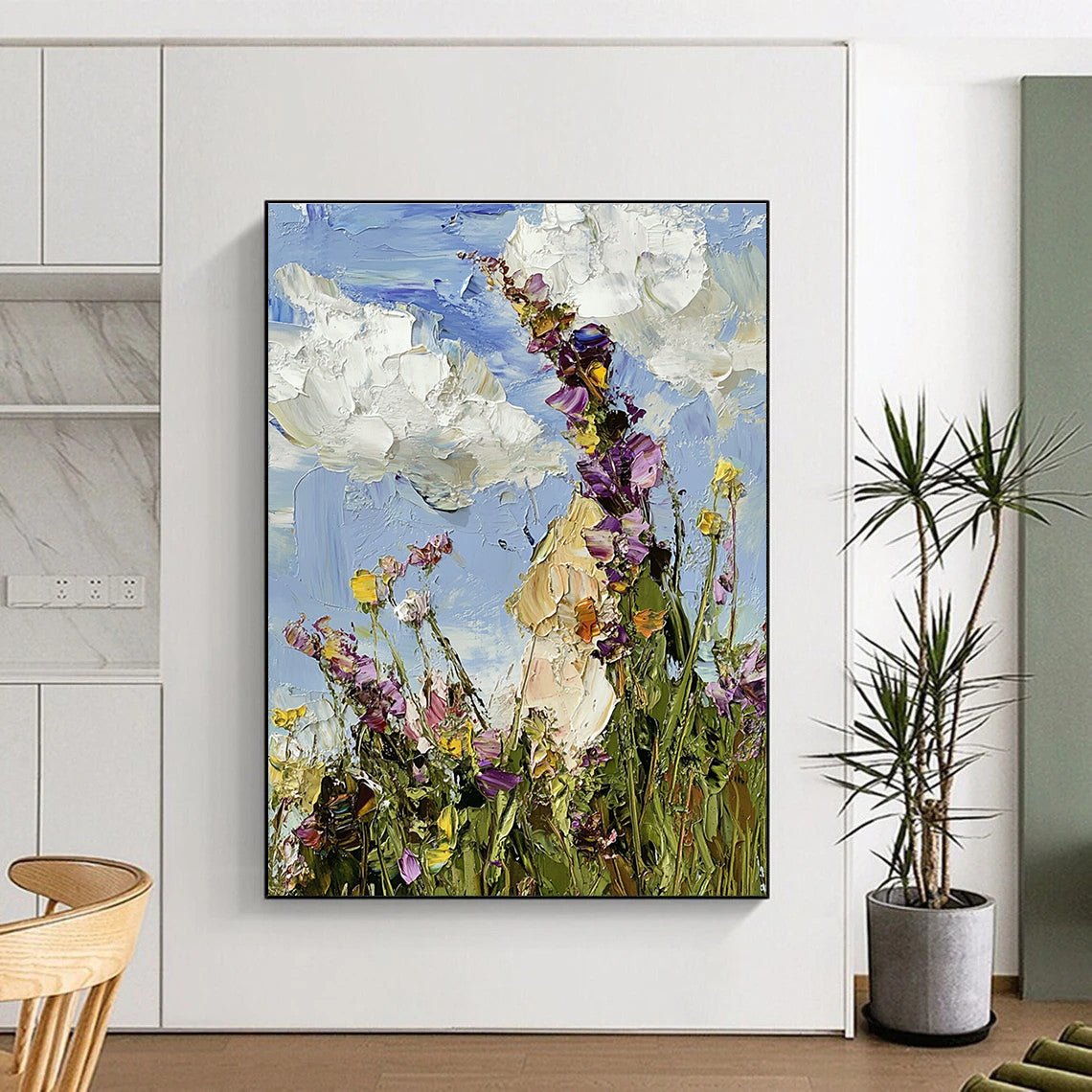 Large abstract oil painting featuring a colorful wildflower meadow under a blue sky with visible brushstrokes in an impressionist style.STSC1367