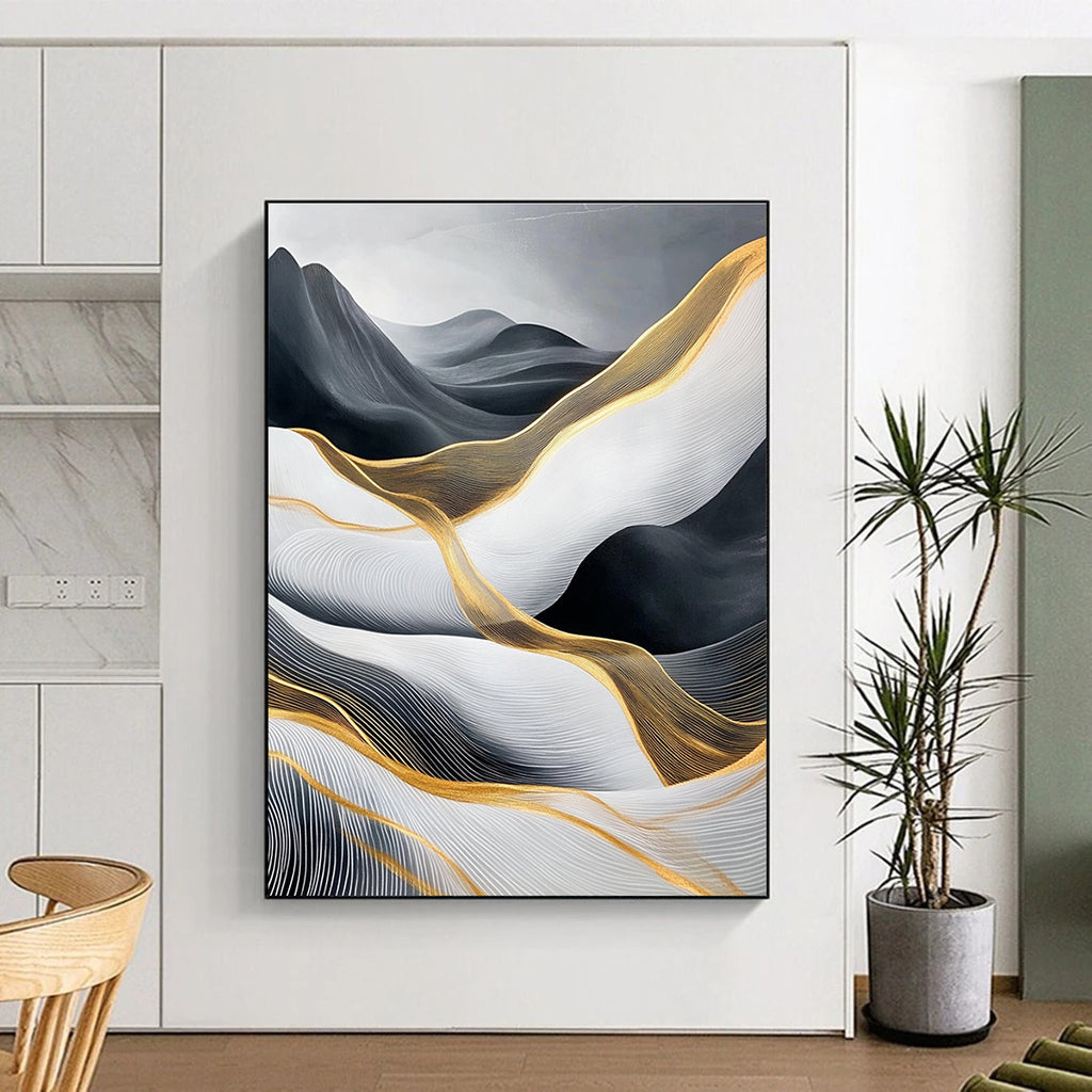 Large abstract painting of flowing waves in light gray and black with gold accents and prominent white areas and mountains.STSC358