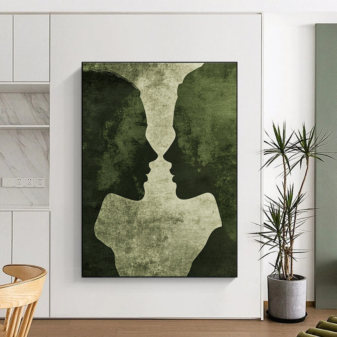 Abstract artwork featuring minimalistic male and female silhouettes in vintage green tones with grunge texture and deep shadows on a dark grey background.STSC1446