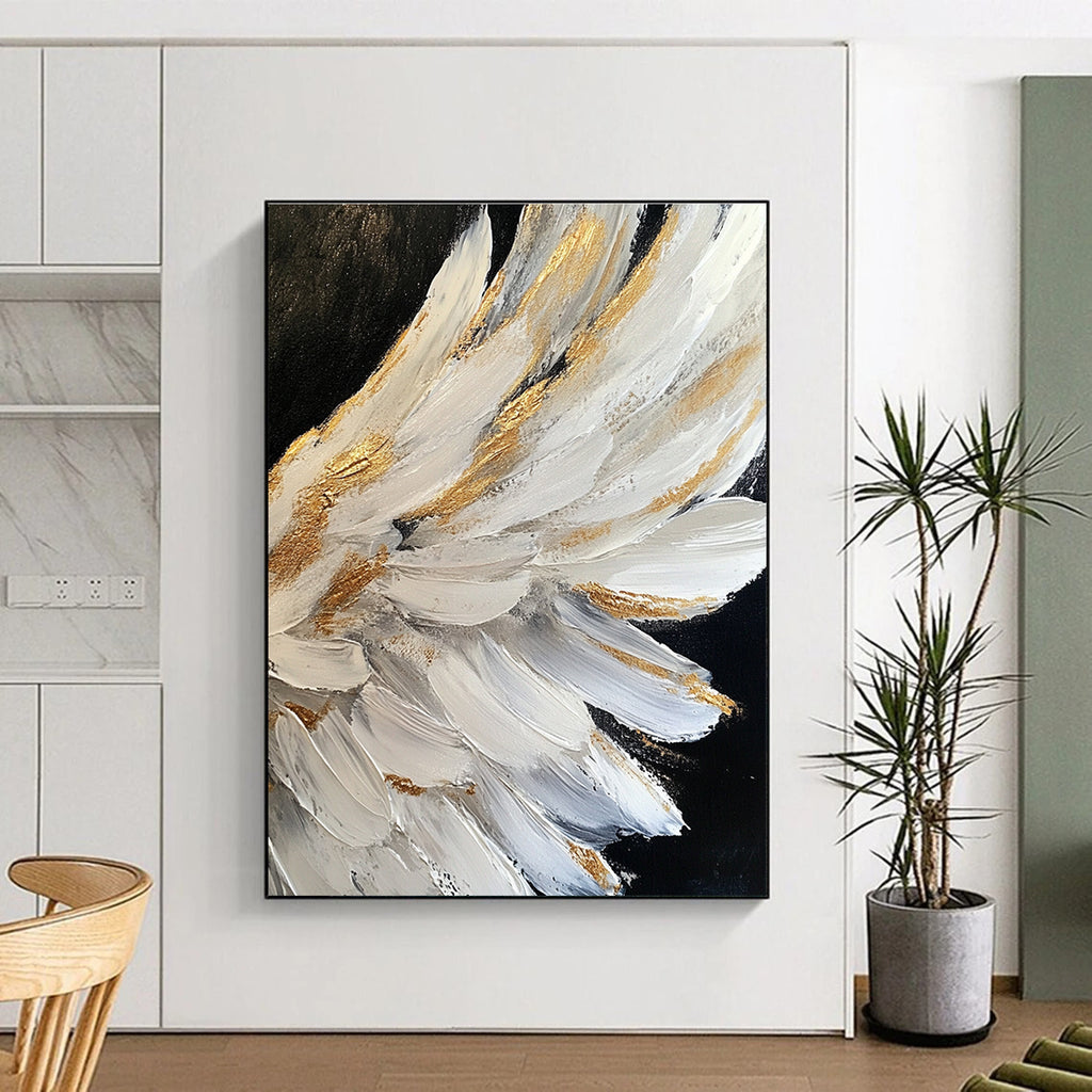 Large abstract painting of white angel wings with gold accents on a black background featuring heavy brush strokes and palette knife work.STSC006