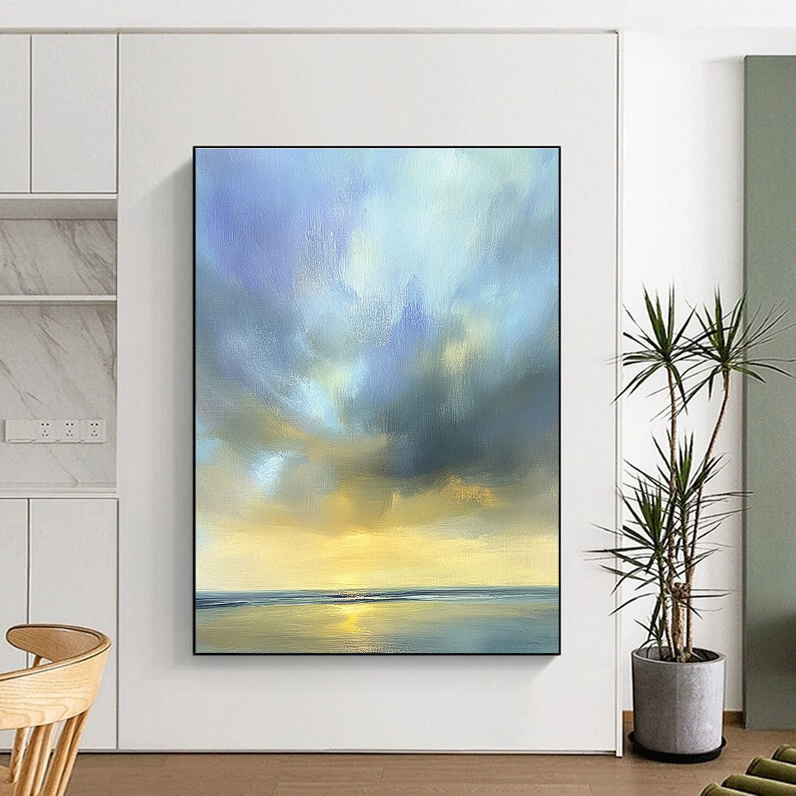 Large abstract oil painting of the sky featuring muted blue light gray and soft clouds over an ocean horizon in beautiful serene colors.STSC201